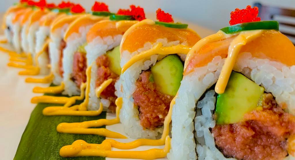 Oishi Hot Roll · Spicy tuna, avocado, topped with salmon, tempura flakes, jalapeno, spicy mayo. Tobiko.