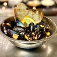 Steamed Mussels · Sauteed with white wine and served with grilled crostini.