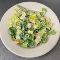 Caesar Salad · Romaine lettuce, homemade croutons, Parmesan cheese and Caesar dressing.