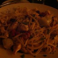 Chicken Cosentino · Chicken pieces sauteed with artichoke hearts, Kalamata olives and sun-dried tomatoes in a wh...