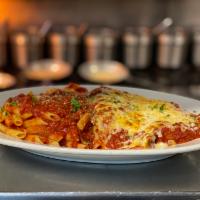 Chicken Parmigiano · Hand breaded chicken breast fried, smothered in mozzarella cheese and our red sauce.