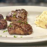 Grilled Lamb Chops · Served with mashed red skin potatoes.