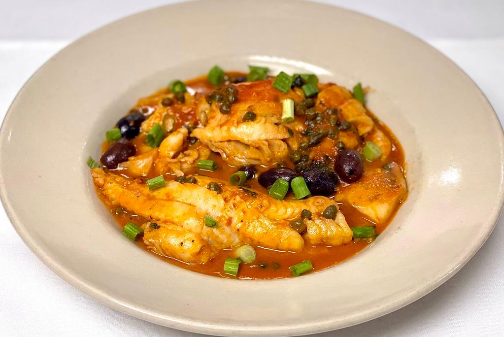 Haddock Italiano · A fresh filet of haddock sauteed with fresh tomatoes, onions, Kalamata olives and red sauce and a touch of white wine.