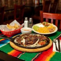 Steak Fajitas · Served with mexican rice, refried beans,salad,guac,pico and corn or flour tortillas.