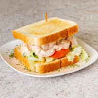 Homemade Shrimp Salad Sandwich · Served with lettuce and tomato.