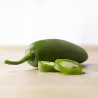 Jalapeño Peppers · Fresh sliced and packed in a spicy brine with turmeric spice.