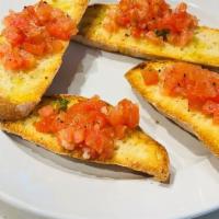Bruschetta · Authentic Italian, homemade bread toasted with tomato, fresh basil, fresh garlic, and extra ...