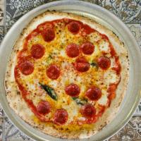 Pepperoni Pizza · San Marzano tomato sauce, mozzarella cheese, pepperoni, Parmesan, olive oil, and basil.