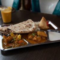 Special Curry Platter Bundle · Chicken curry, mixed veg curry, 1 naan bread, 1 samosa, chutney, and basmati rice. Served wi...