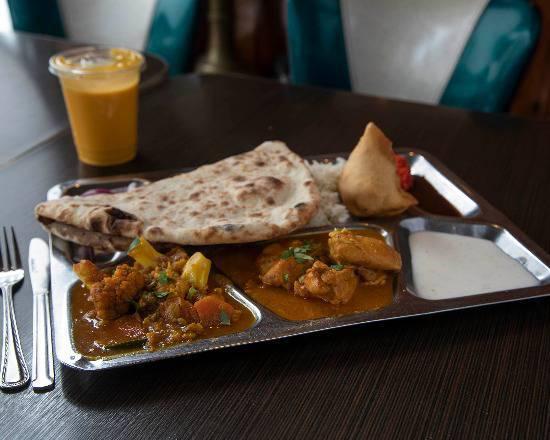 Special Curry Platter · Chicken curry, mixed veg curry, 1 naan bread, 1 samosa, chutney, and basmati rice.