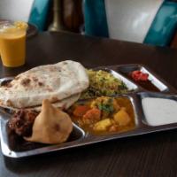 Veggie Special for 2 · For 2 to enjoy. Mixed veg curry, dal, chole, vegetable biryani, 2 samosas, and 2 pieces of t...