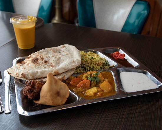 Veggie Special for 2 · For 2 to enjoy. Mixed veg curry, dal, chole, vegetable biryani, 2 samosas, and 2 pieces of tandoori roti.