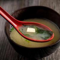 Miso Soup · Miso soybean broth with tofu, seaweed, and scallions.