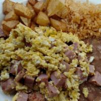 Huevos con Jamon · Ham and eggs. Served with rice,  beans and potatoes.