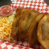 Deep Fried Tacos · Served with lettuce, cheese and salsa.
