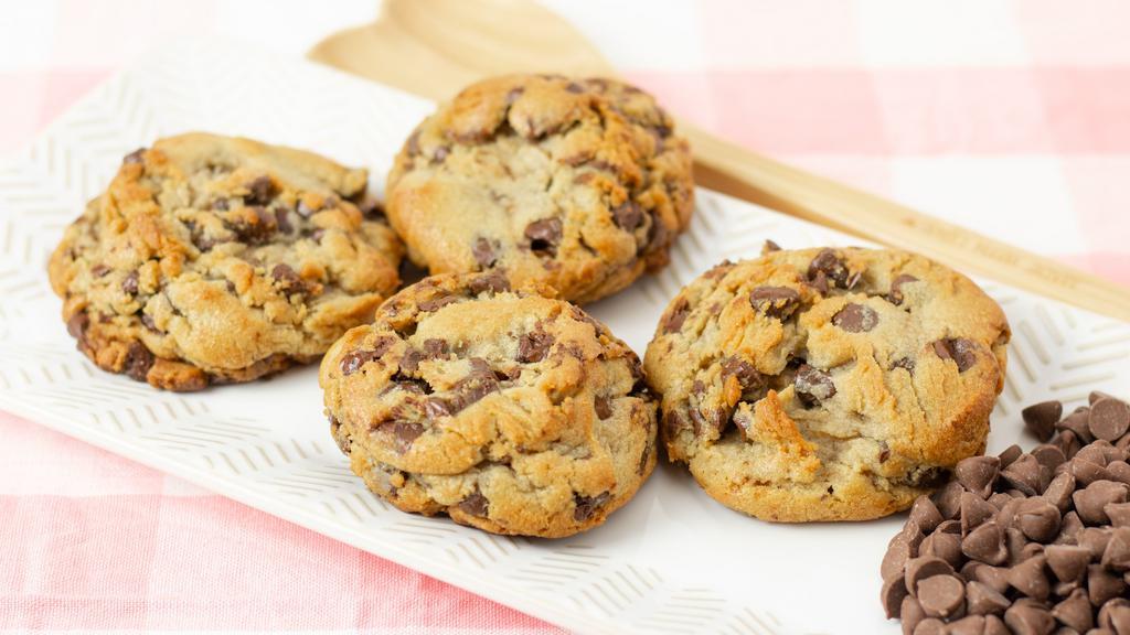 Giant Chocolate Chip Cookies · Cakey Chocolate Chip Cookies, best when dipped in a cold glass of milk! 

If you love cakey cookies, these are the ones for you, packed with tons of semi-sweet chocolate chips and baked to a golden brown, these cookies are a real crowd pleaser! 
