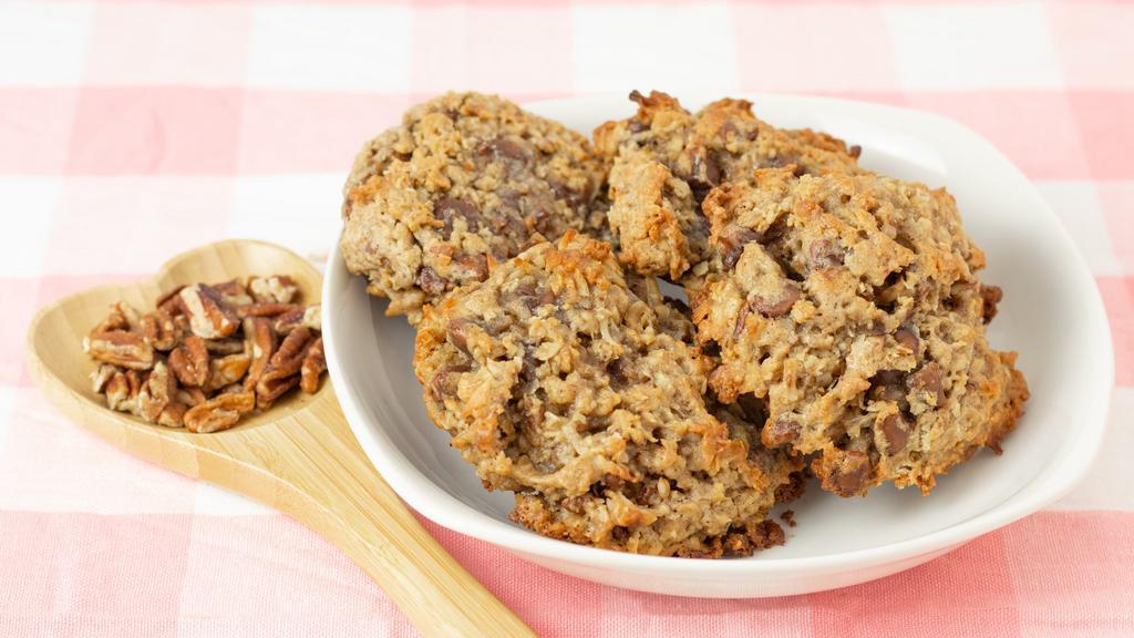 Giant Cowgirl Cookies · Do you love cowboy cookies? Cowgirl cookies are just a touch sweeter! Try them today with an ice-cold glass of milk!

Just like the Cowboy cookies you love but with finely chopped pecans, milk chocolate chips, and sweet coconut flakes!
