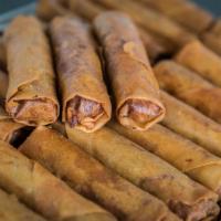 Egg Rolls 25 Pieces · 25 Pieces homemade crispy egg rolls stuffed with chicken, pork, carrots, and taro. Served wi...