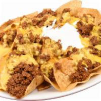 Nachos with Beef · Crispy tortillas chips smothered with melted nacho cheese, jalapeno,sour cream and ground beef