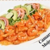 Camarones al Mojo de Ajo · Delicious shrimp sauteed in a special garlic and butter sauce server with spanish rice, seas...