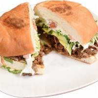Torta Dinner · Traditional mexican sandwich made with refried beans, cheese, avocado, lettuce, tomatoes sou...