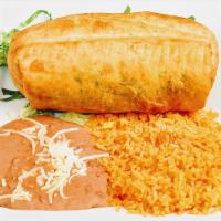 Chimichanga Dinner · A fried jumbo burrito filled with your choice of meat, rice, cheese, lettuce, tomatoes , ser...