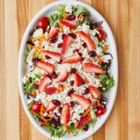 Strawberry Salad · Feta cheese, fresh strawberries, sun-dried cranberries over house salad & oil vinaigrette dr...