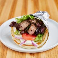 Beef Souvlaki  · Beef kabab, feta sauce, lettuce, tomatoes, onion and oil and vinegar. GF option available