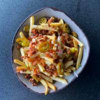 Loaded Hand-Cut Cheese Fries · Hand-cut golden french fries topped with homemade queso, smoky bacon, jalapenos & pico de ga...