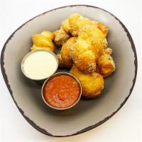 Garlic Knots · Puffed fried dough knots sprinkled with Parmigiano-Reggiano cheese & garlic served with our ...