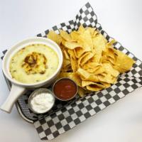 Spinach Artichoke Dip · Creamy mixture of spinach, tender artichokes & parmesan, served with tortilla chips, smoky s...