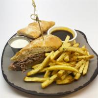 Prime Rib French Dip · Slow-roasted prime rib stacked on a grilled baguette with homemade horseradish aioli & au jus