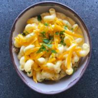 Mac & Cheese · Spiral macaroni in a creamy cheese sauce topped with parsley