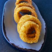 Onion Rings · Hand-battered, lightly fried & served with ranch dressing