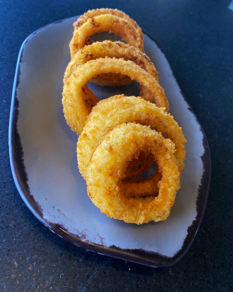 Onion Rings · Hand-battered, lightly fried & served with ranch dressing