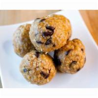 Peanut Butter & Chocolate Chip Bites · Peanut butter, chocolate chips, whole grain oats, whey protein, coconut shavings, and honey.