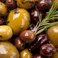 Olives · Kalamata and Castelvetrano olives marinated in oil, citrus, herbs and garlic. 
