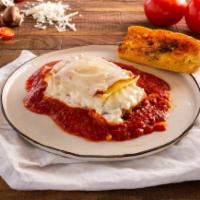 Meat Lasagna · Layered lasagna noodles with seasoned grounded beef with ricotta and mozzarella.
