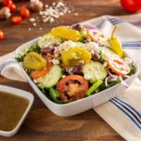 Greek Salad · Romaine lettuce, Greek olives, cucumbers, tomatoes, red onions, and feta cheese.