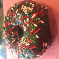 White Cake Donut with Chocolate Icing and Rainbow Sprinkles · 