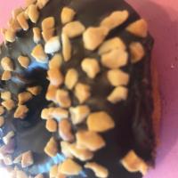 White Cake Donut with Chocolate Icing and Peanuts · 