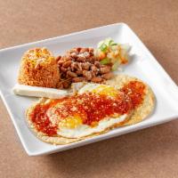 Huevos Rancheros · The basic dish consists of fried eggs served upon lightly fried corn tortillas topped with r...