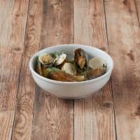 Clam Steamer · Clams steamed with white wine, garlic, butter, Italian pesto and fresh basil.