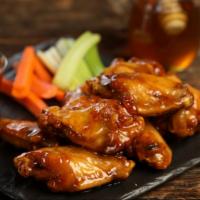 Hot Honey · 8 hot honey wings (medium heat), served with carrots & celery and a choice of blue cheese, c...