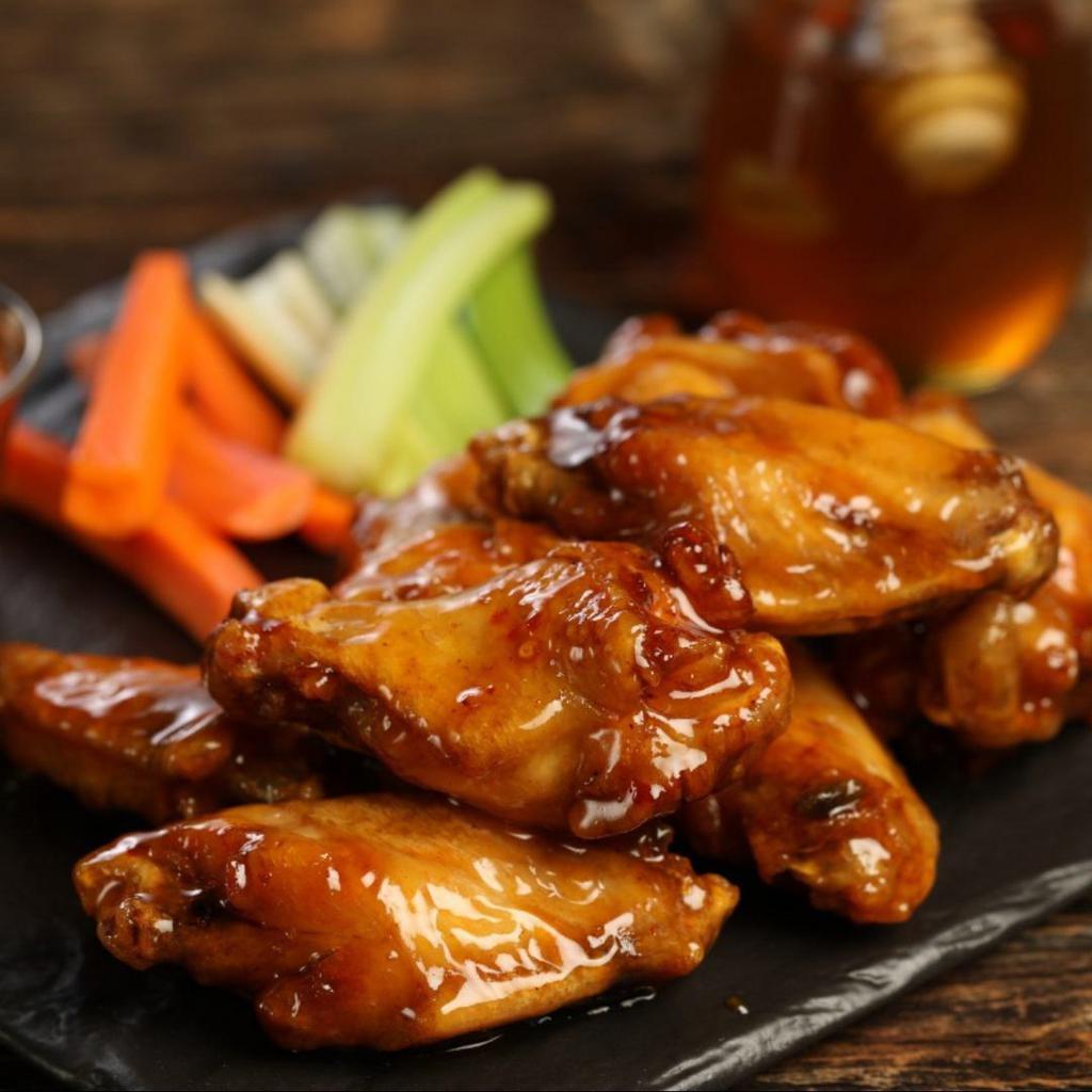 Hot Honey · 8 hot honey wings (medium heat), served with carrots & celery and a choice of blue cheese, classic ranch, or Sriracha ranch for dipping