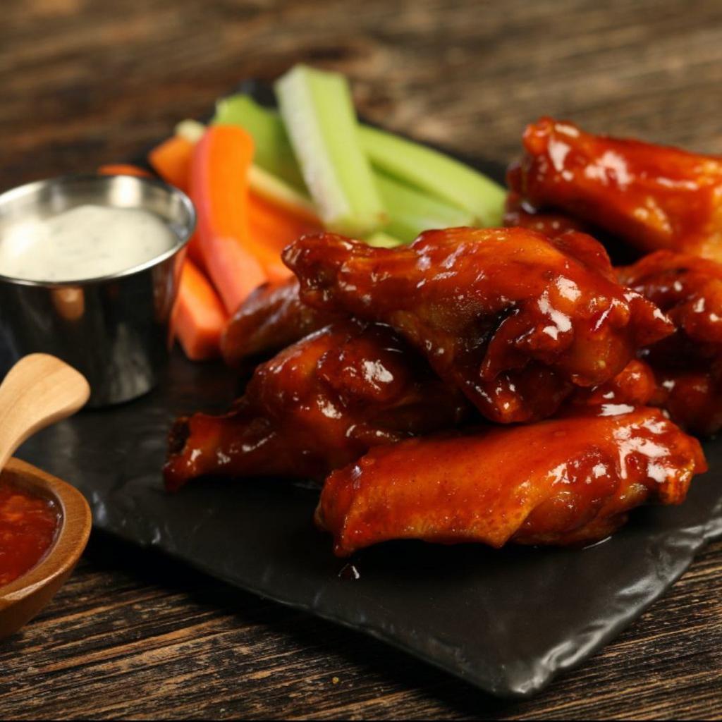Sweet Chili · 8 sweet chili wings (mild heat), served with carrots & celery and a choice of blue cheese, classic ranch, or Sriracha ranch for dipping