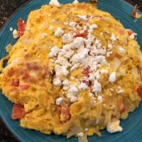 Greek Frittata · Tomatoes, onions, potatoes and feta cheese, all baked together to form a delicious and healt...