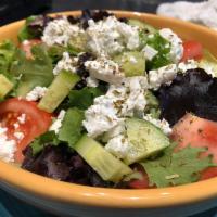 Greek Salad · Organic mixed greens, tomato, cucumber, red onion, imported feta cheese, green pepper, and K...