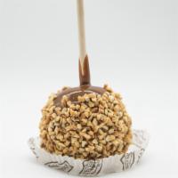 Peanut Caramel Apple · A Granny Smith apple covered in fresh caramel, rolled in chopped peanuts.
