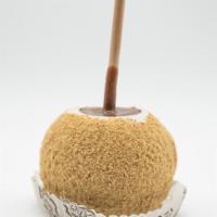 Cheesecake Caramel Apple · A Granny Smith apple covered in fresh caramel, rolled in white confection, topped with crush...